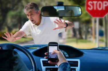 distracted-driver-runs-into-walking-pedestrian-scaled.webp
