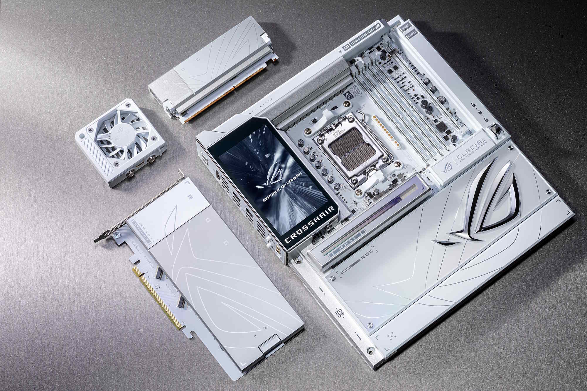 The ROG Crosshair X870E Glacial motherboard on a table with its bundled accessories