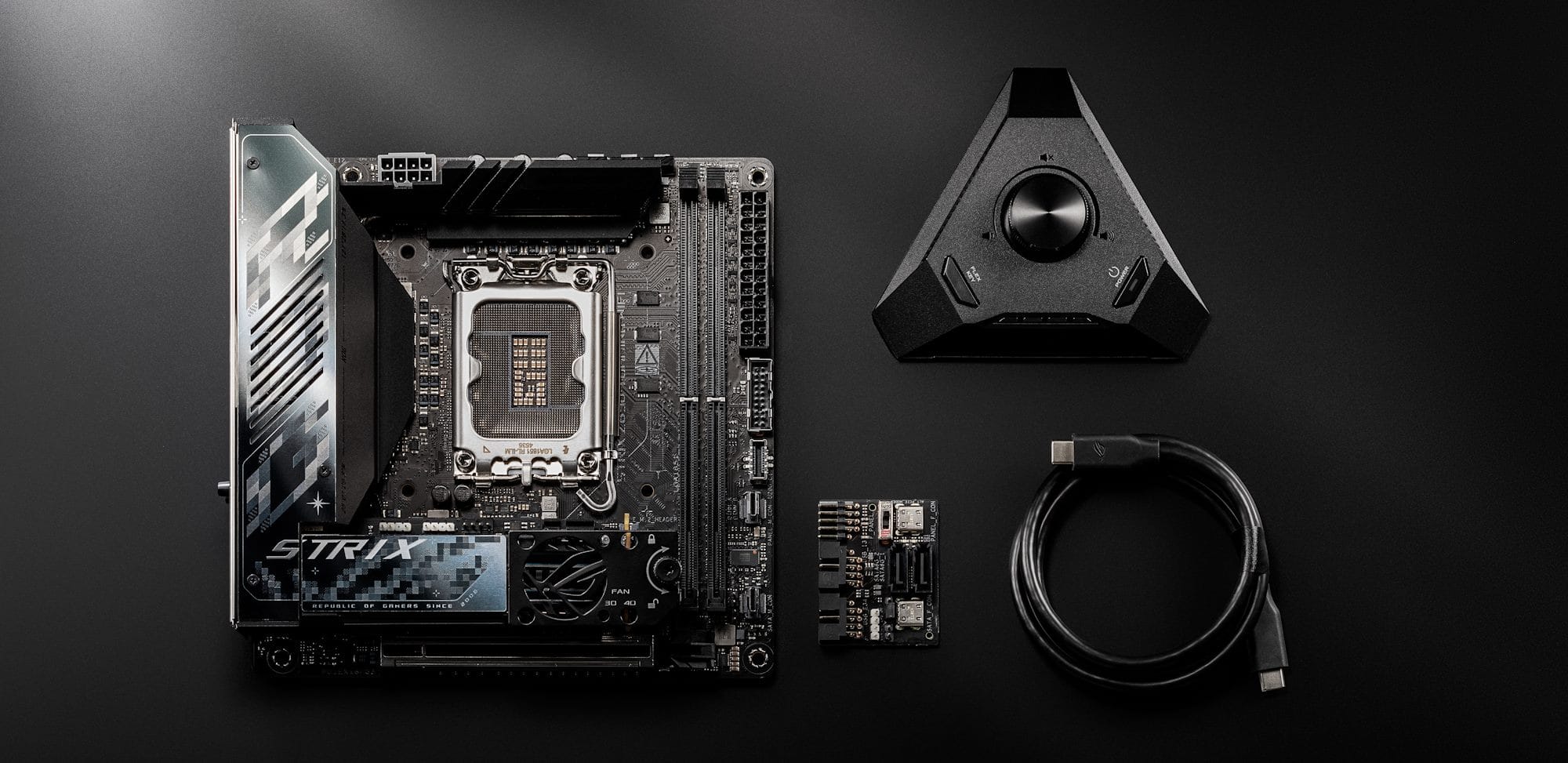 The ROG Strix Z890-I Gaming WiFi motherboard on a table next to its accessories