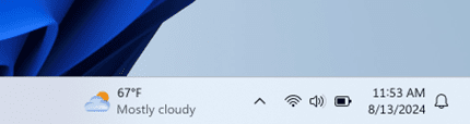 The Widgets entry-point at its new position to the left of system tray on a left-aligned taskbar.