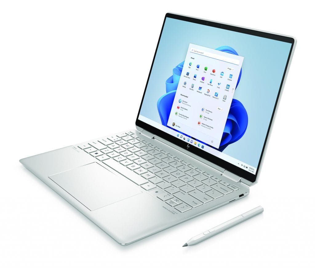 Laptop open and facing left with digital pen Laptop open and facing left with digital pen